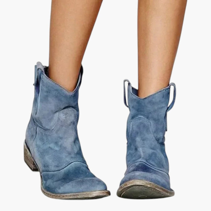Damernas ankelboots med dragflikar och strukturerad sula