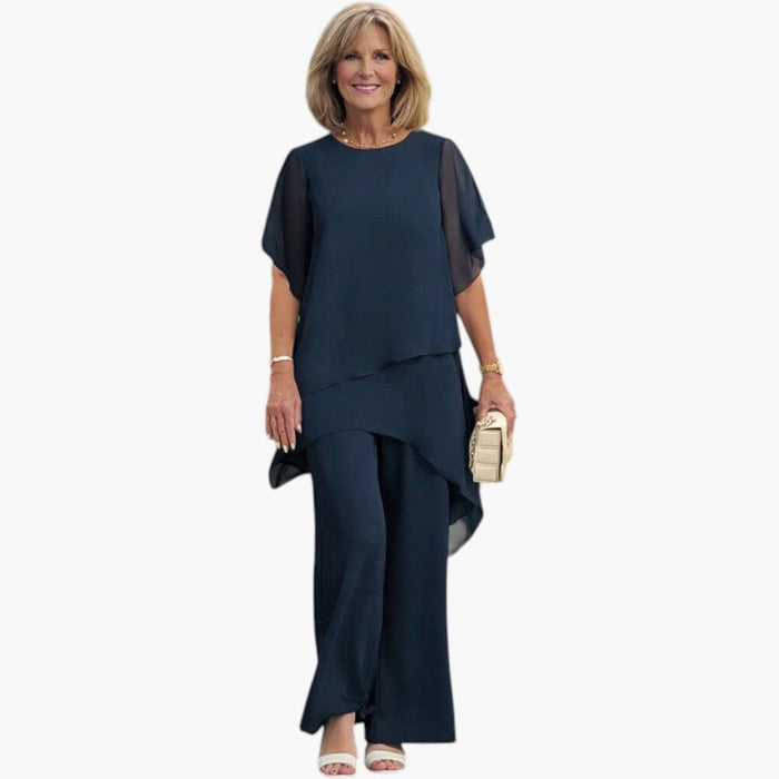 Completo da donna con top asimmetrico e pantaloni a gamba larga