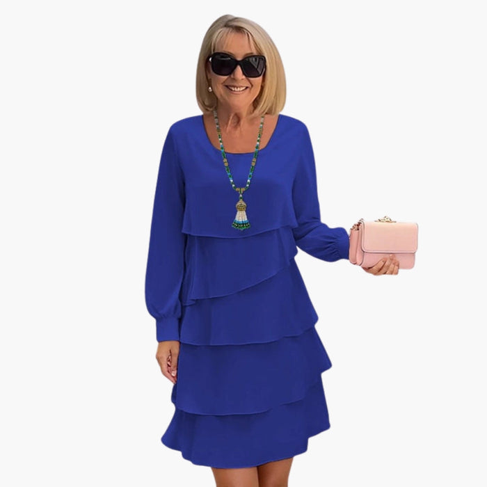 Vestido de mujer con falda escalonada y mangas largas